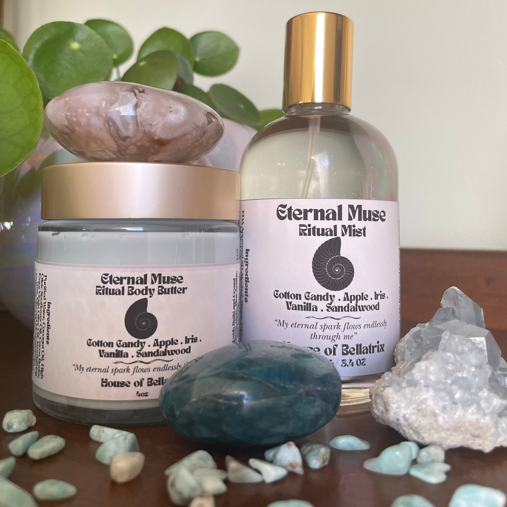 Eternal Muse Ritual Mist bottle with a jar and decorative stones on a neutral background